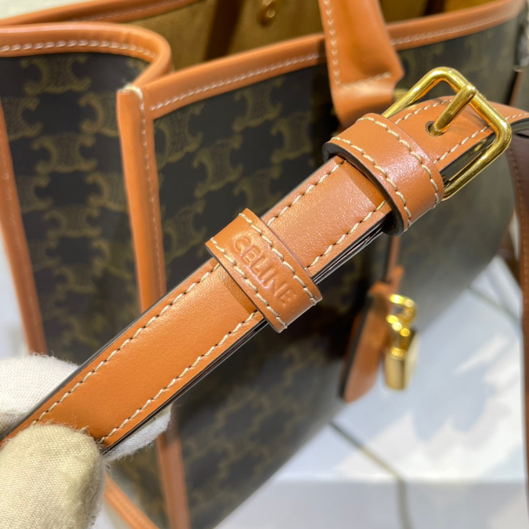 CELINE 25S HORIZONTAL CABAS 34MM IN BLACK TRIOMPHE CANVAS AND BROWN CALFSKIN