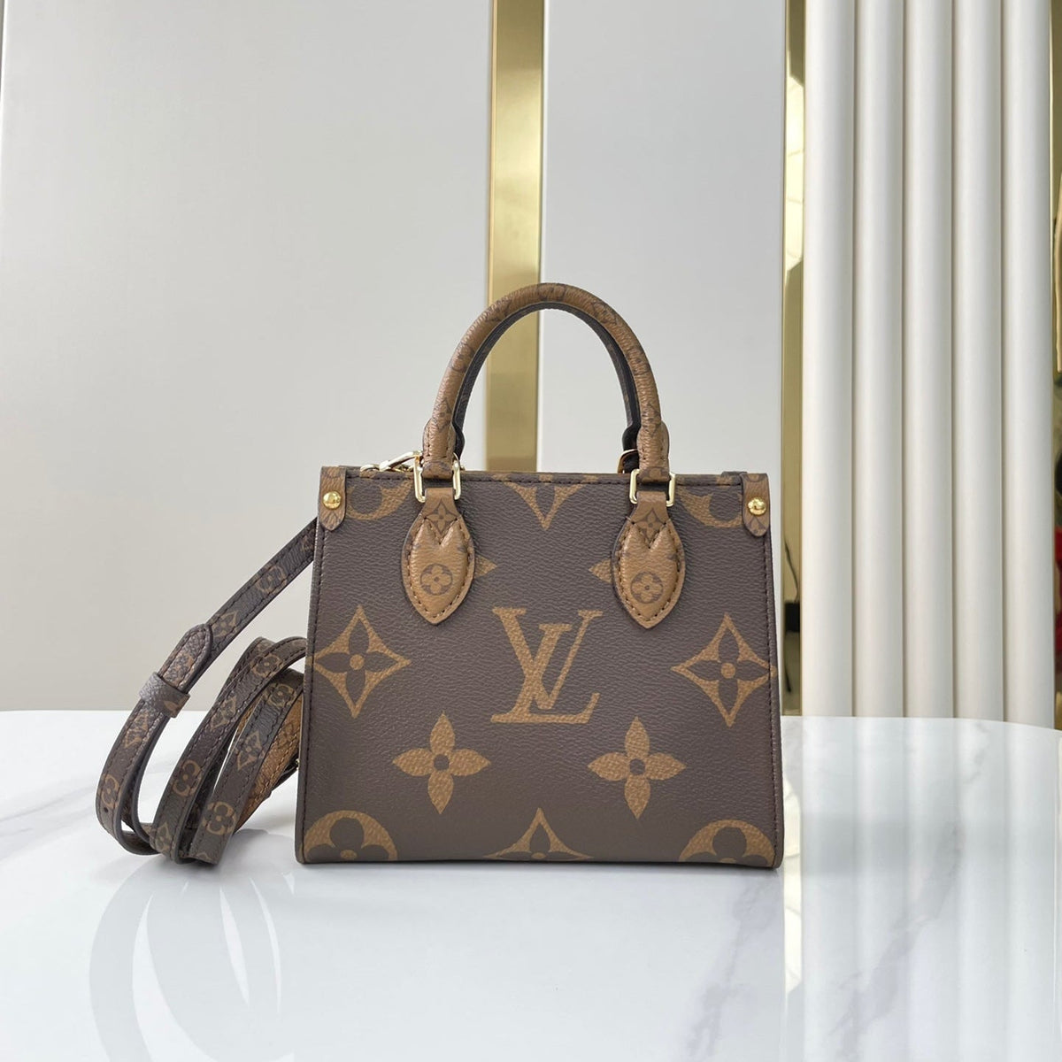 LOUIS VUITTON ONTHEGO BB 18 IN BROWN MONOGRAM AND MONOGRAM REVERSE CANVAS