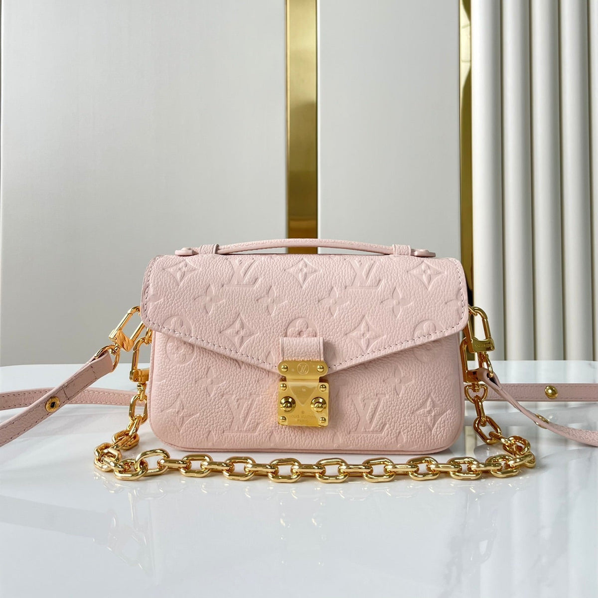 LOUIS VUITTON POCHETTE MÉTIS EAST WEST 21 IN PINK OPALE MONOGRAM ECLIPSE CANVAS GOLD BUCKLE