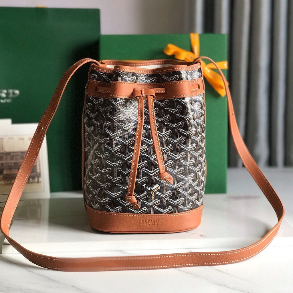 PETIT FLOT BUCKET BAG 22 IN BLACK GOYARDINE CANVAS AND TAN LAMBSKIN TRIM