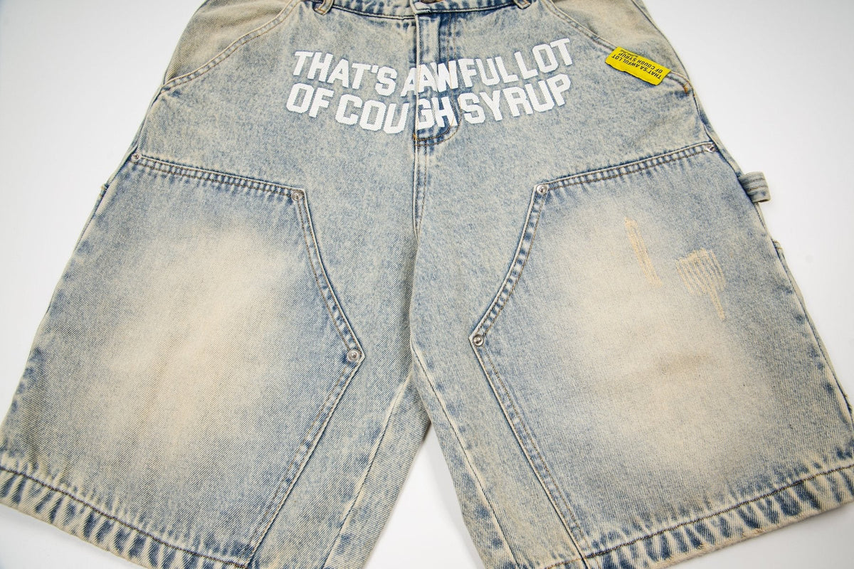 THAT'S A AWFUL LOT OF COUGH SYRUP Washed Denim Graphic Shorts — front
