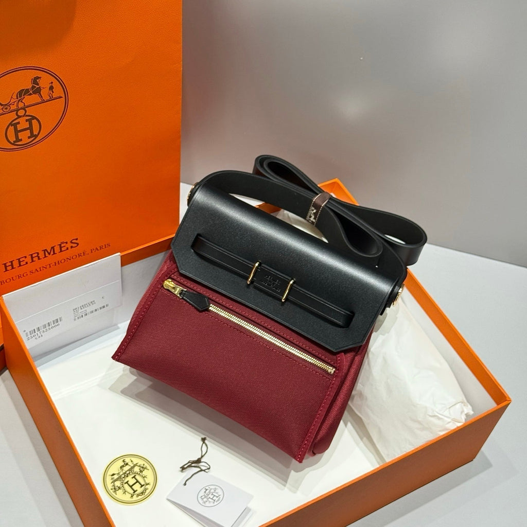 HERMES 25S MINI HERBAG 20 IN RED AND BLACK CANVAS GOLD HARDWARE