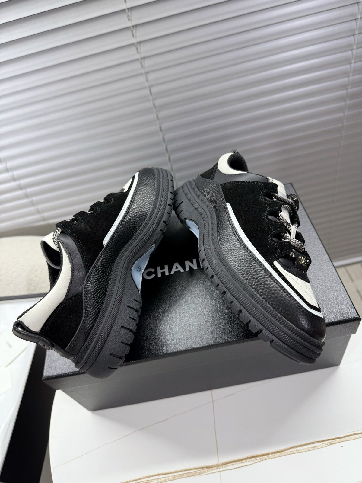 CHANEL 25S SNEAKERS 35MM IN BLACK AND WHITE CALFSKIN