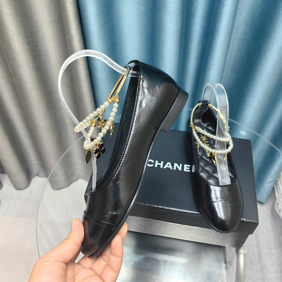 CHANEL MARY JANE WITH PEARL STRAP IN GLOSSY BLACK LAMBSKIN